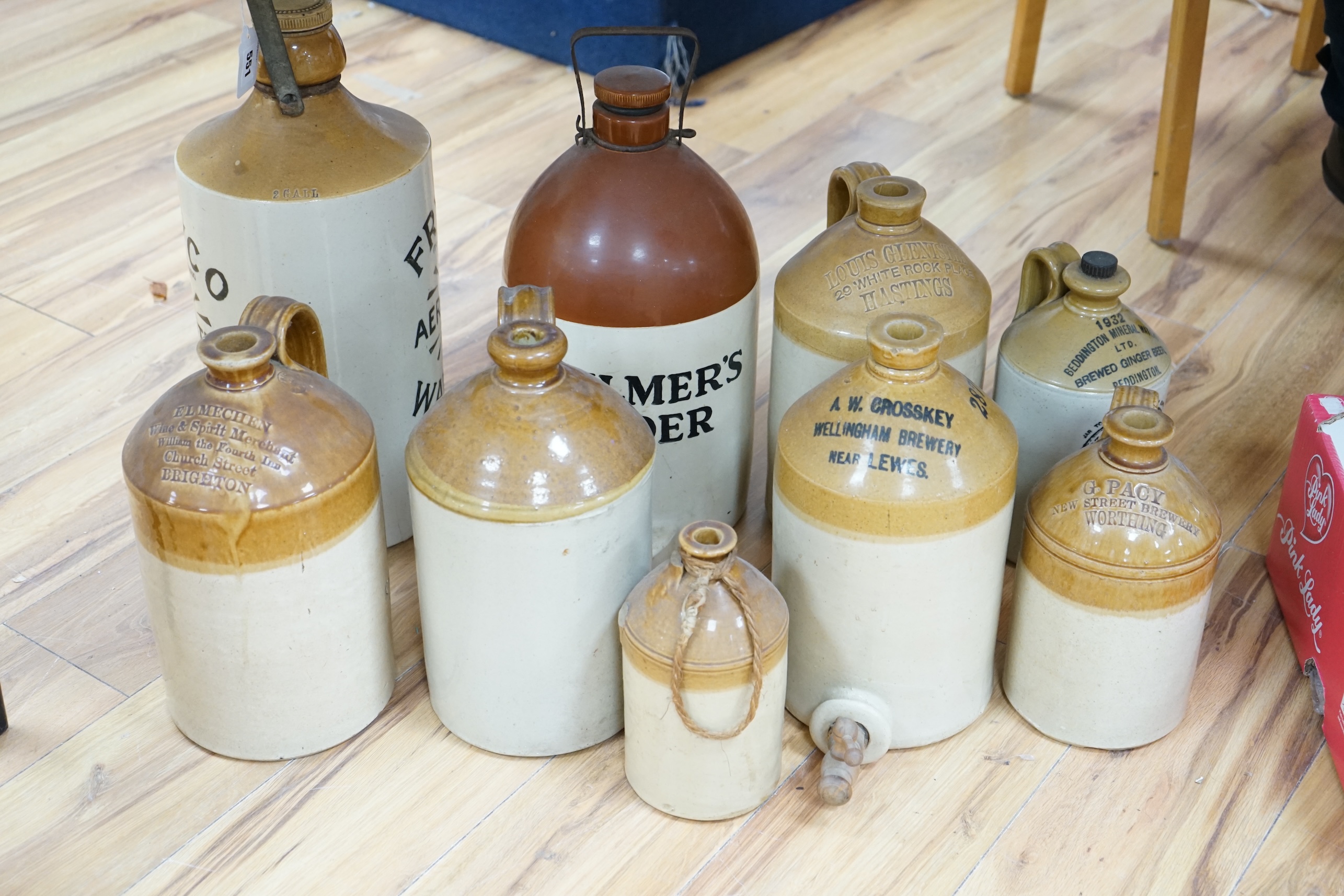 Nine various stoneware vessels including local brewers such as Lewes, Worthing, Hastings and Brighton. Condition - fair to good